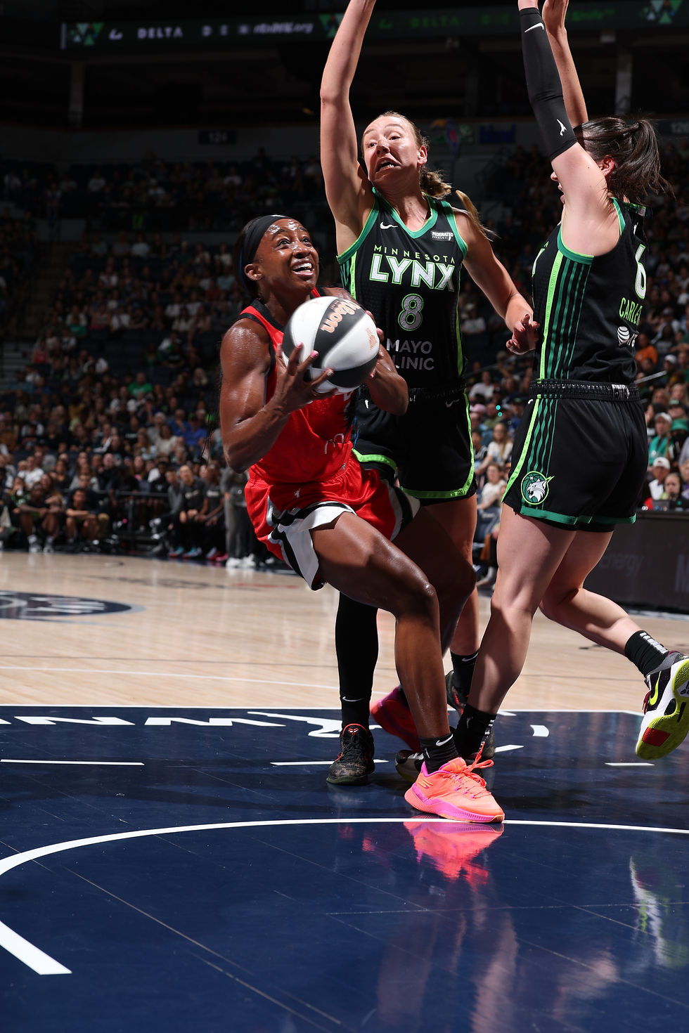 Las Vegas guard Jackie Young looks for space inside a crowded paint against Minnesota. Photo Credit: Las Vegas Aces
