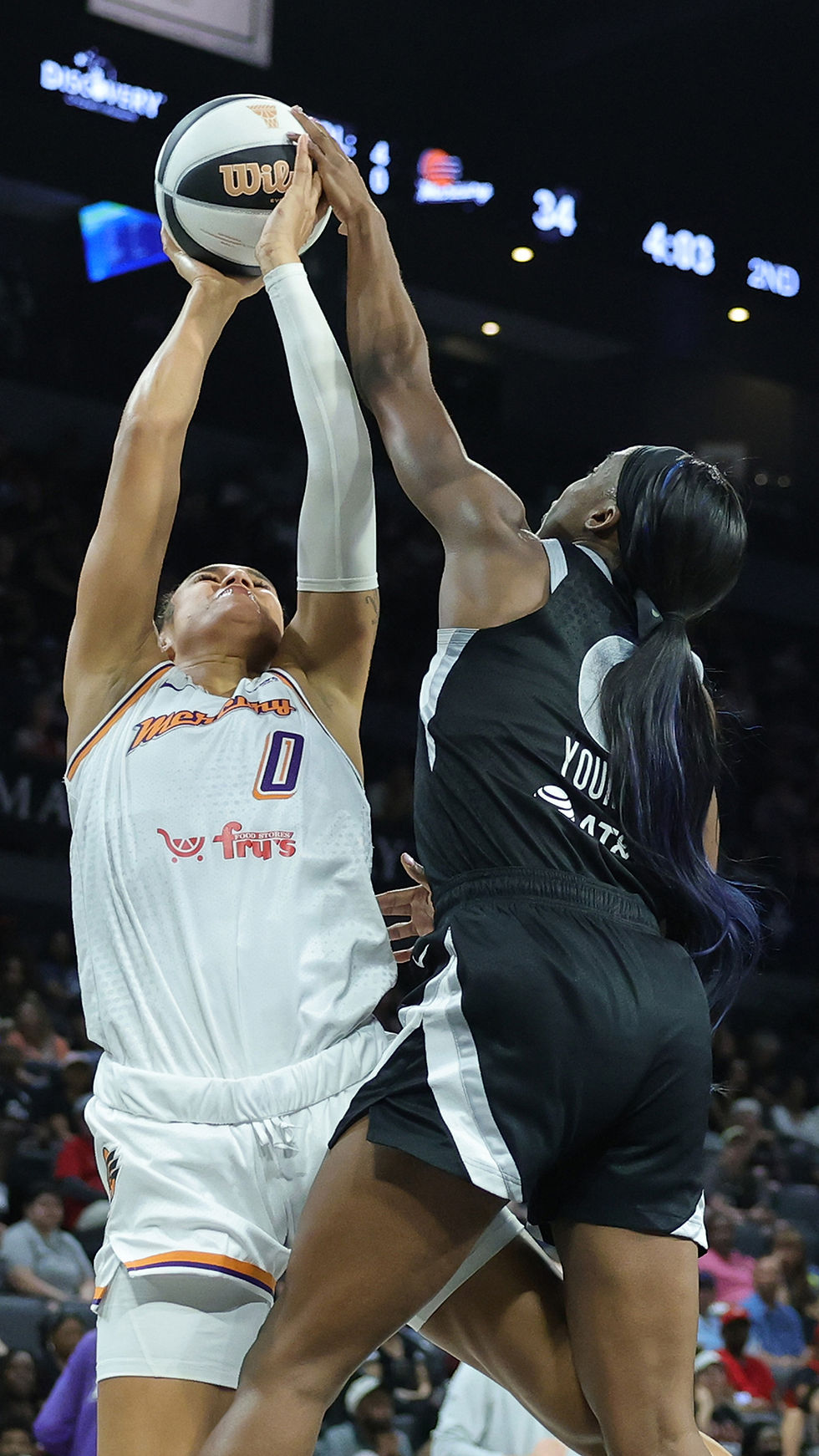 Aces guard Jackie Young gets up to block Mercury forward Satou Sabally's shot inside the Michelob Ultra Arena. Photo Credit: Las Vegas Aces
