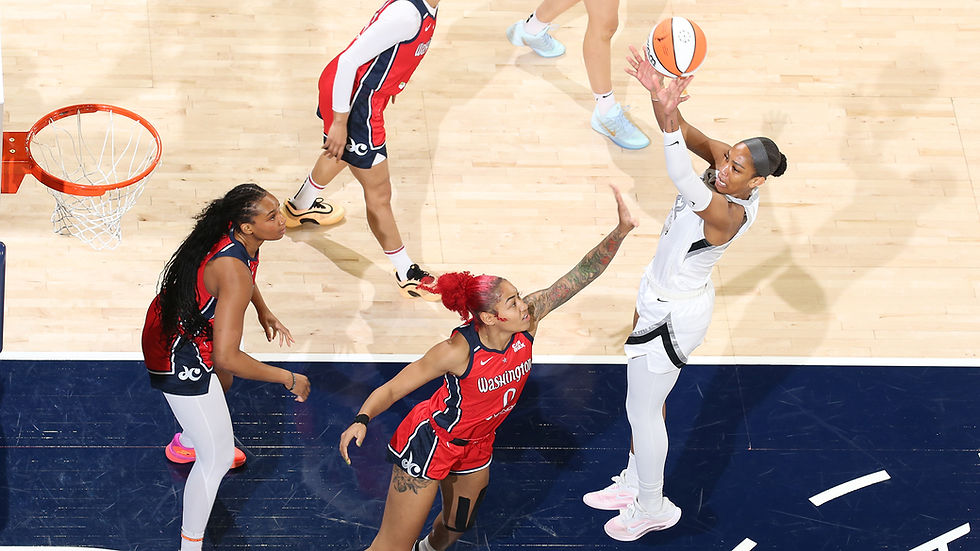Las Vegas forward A'ja Wilson attempts a close-range jumper over Washington center Shakira Austin. Photo Credit: Las Vegas Aces