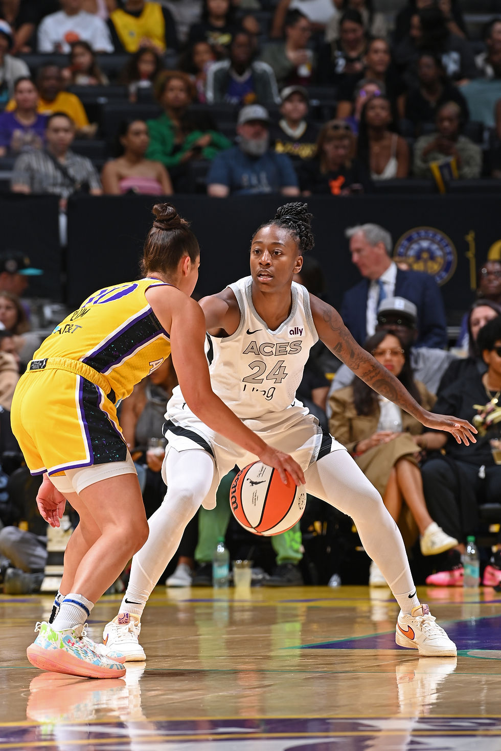 Las Vegas guard Jewell Loyd gets in her defensive stance against Los Angeles guard Kelsey Plum. Photo Credit: Las Vegas Aces
