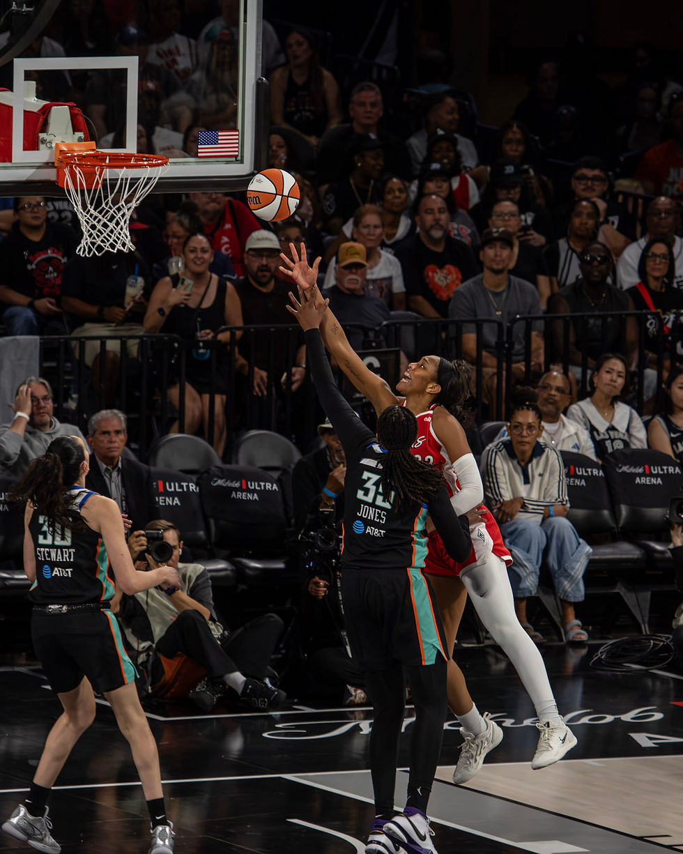 Aces forward A'ja Wilson finishes at the rim with her right hand during the team's home win over the Libert. Photo Credit: Adan Castillo/Talk that Talk