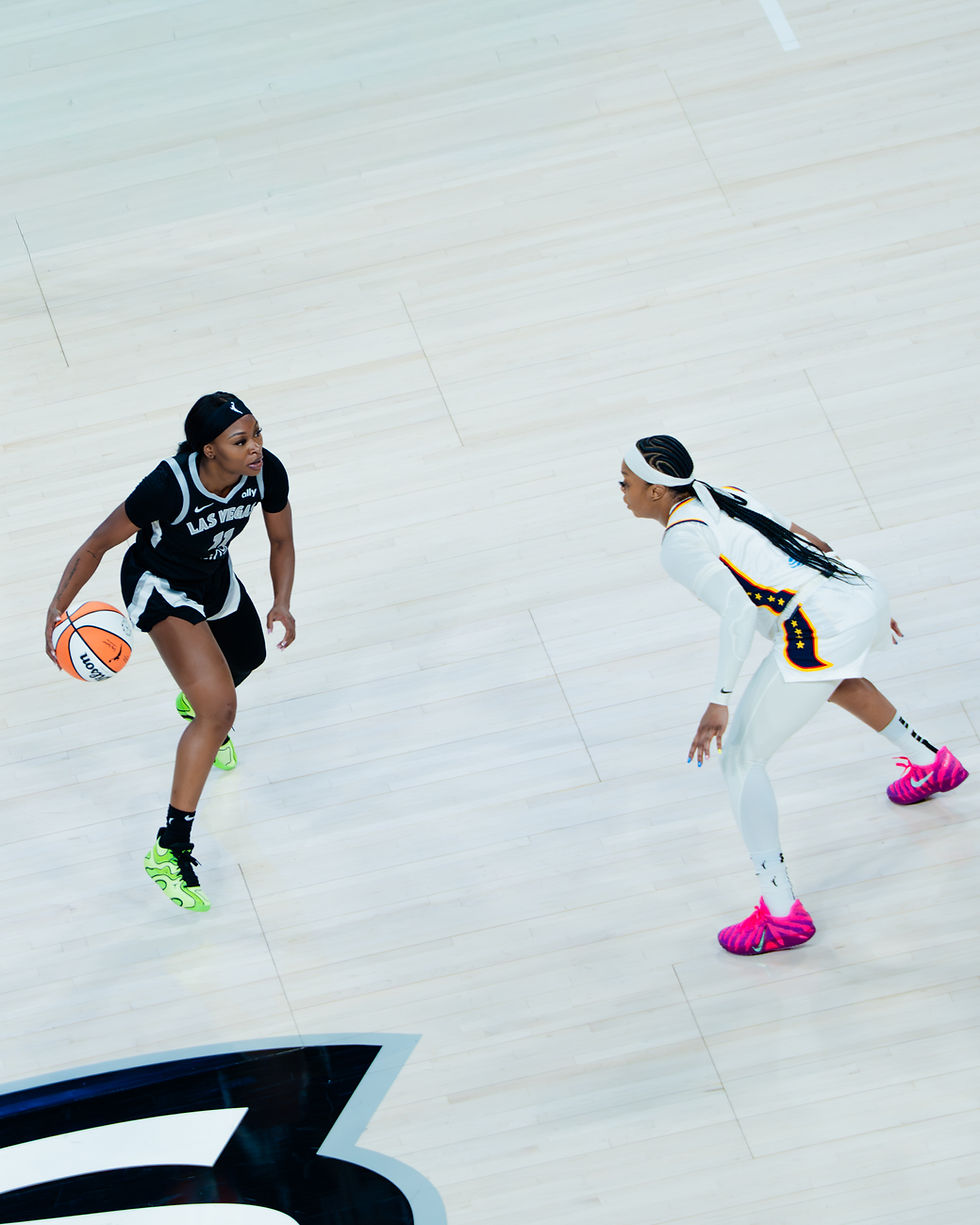 Las Vegas guard Dana Evans looks to make a move while guarded by Indiana guard Odyssey Sims. Photo Credit: Marcell Gordon/Talk that Talk