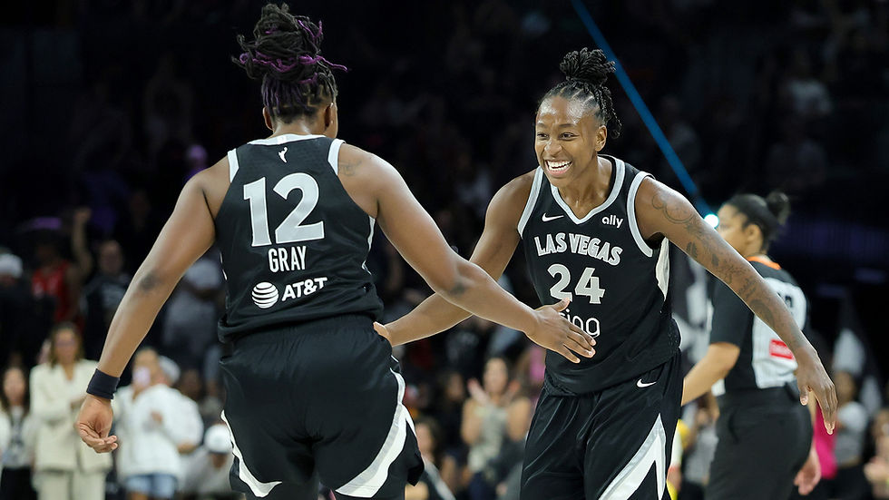 Aces guard Chelsea Gray (#12) and Jewell Loyd (#24) celebrate inside the Michelob Ultra Arena during the team's four-point win over the Storm. Photo Credit: Las Vegas Aces