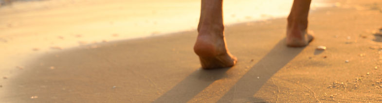 walking on beach sunset_edited.jpg