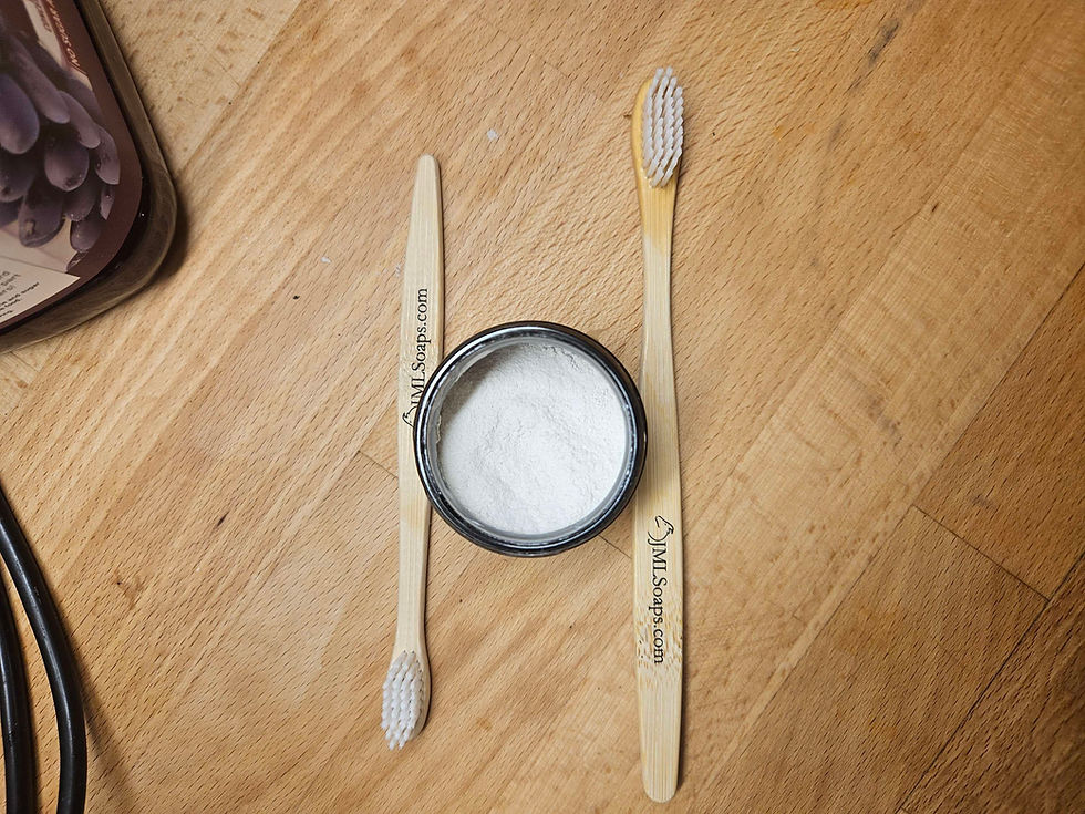 Thumbnail: Two toothbrushes and a jar of powder on a wooden table surface.