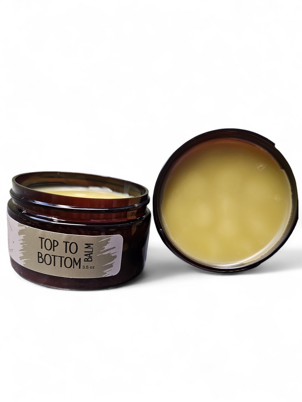 Thumbnail: Open jar of balm with 'TOP TO BOTTOM' label on white background.