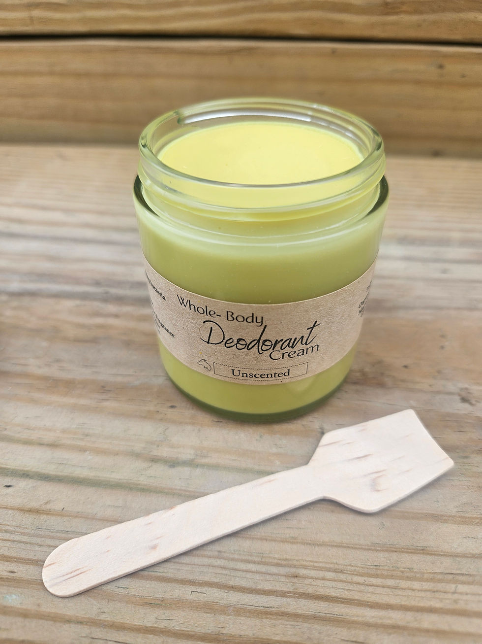 close up of open jar of all natural shoe body tallow deodorant cream with magnesium