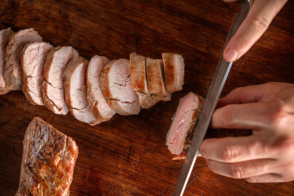 Pork tenderloin, a valuable source of protein, being sliced