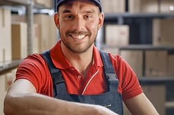 smiling-worker-sitting-his-desk-260nw-1242875086.jpg