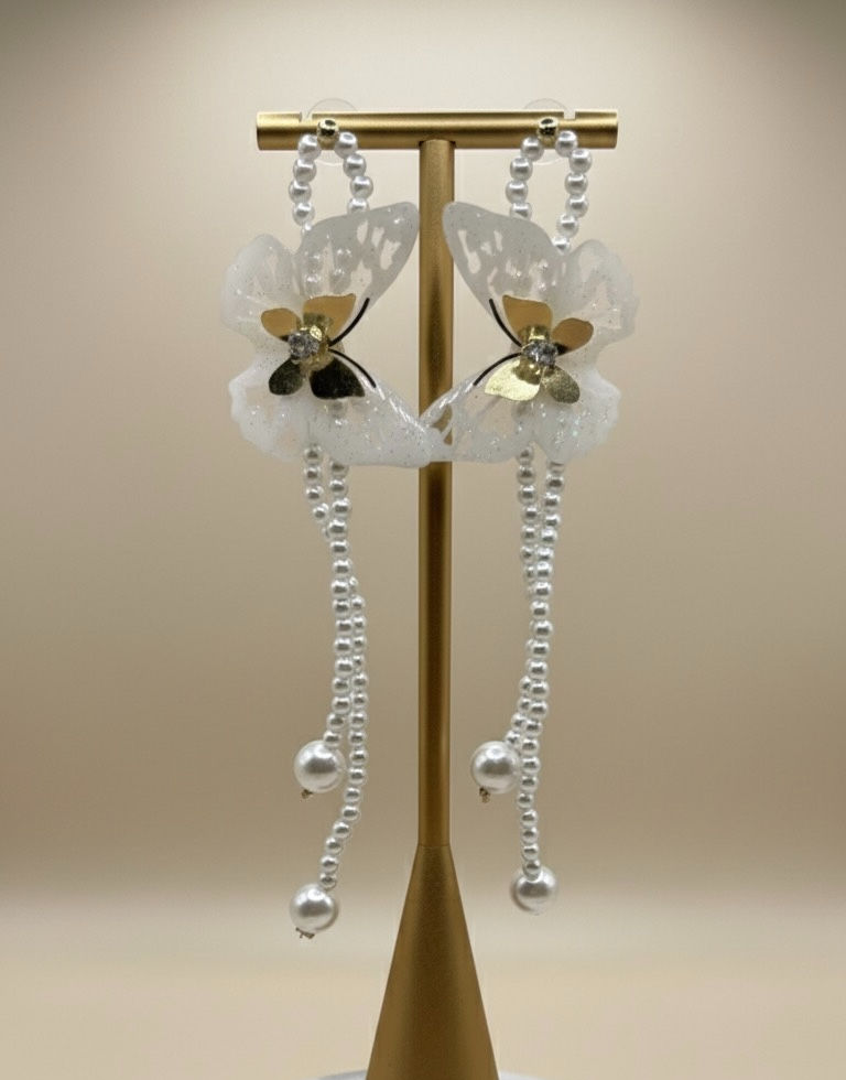 White butterfly earrings with pearls. Gold stand, elegant design. Lavish Jewellery.