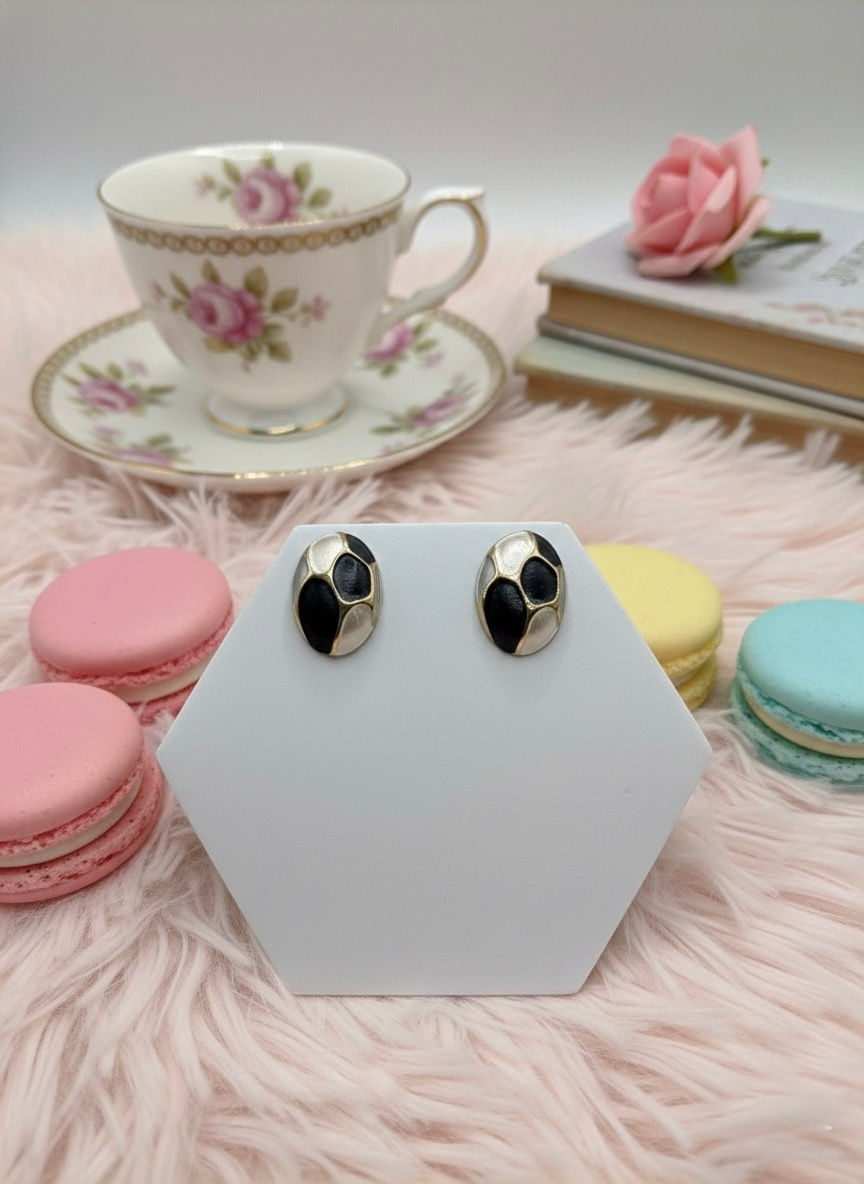 Oval earrings on display with soft background and macaroons Lavish Jewellery.