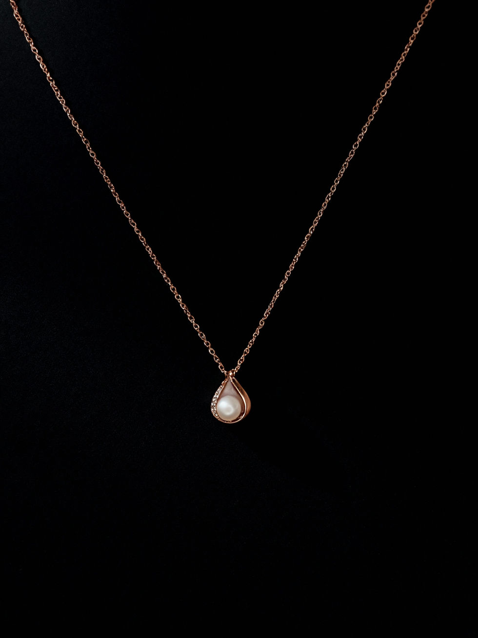 Rose gold necklace with a teardrop pearl pendant, Lavish Jewellery.
