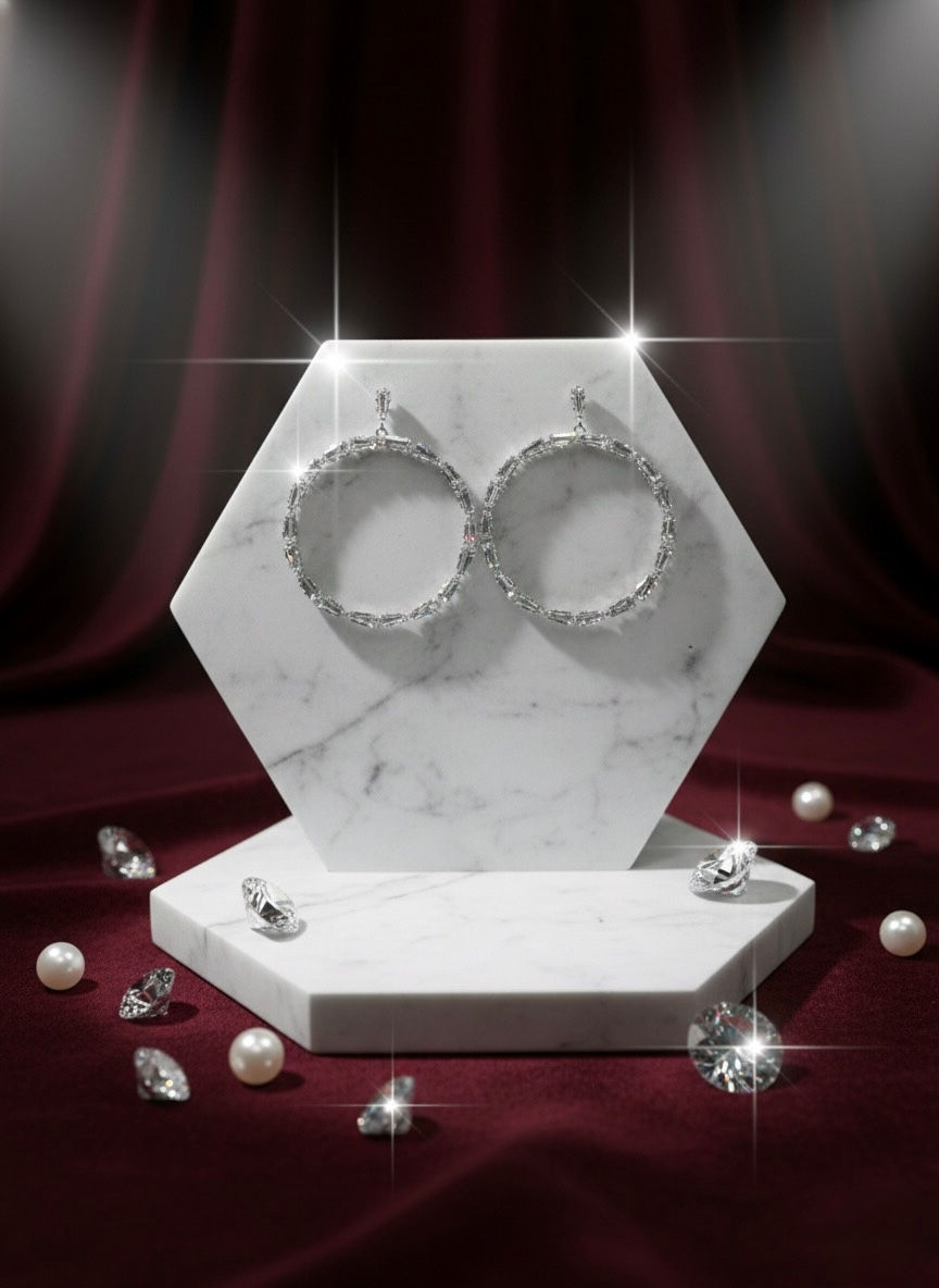 Silver hoop earrings on display with diamonds and pearls, Lavish Jewellery.