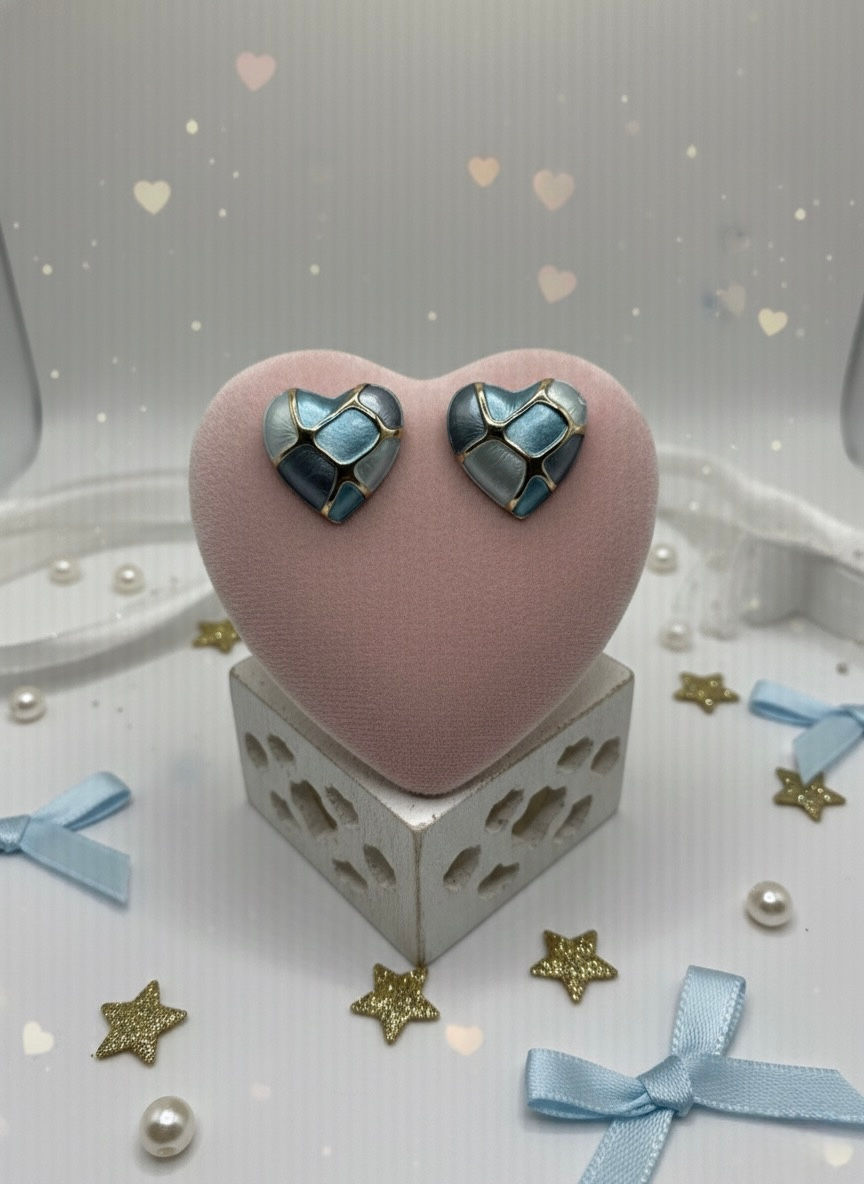 Heart-shaped earrings on a pink heart stand. Lavish Jewellery. Geometric design earrings.