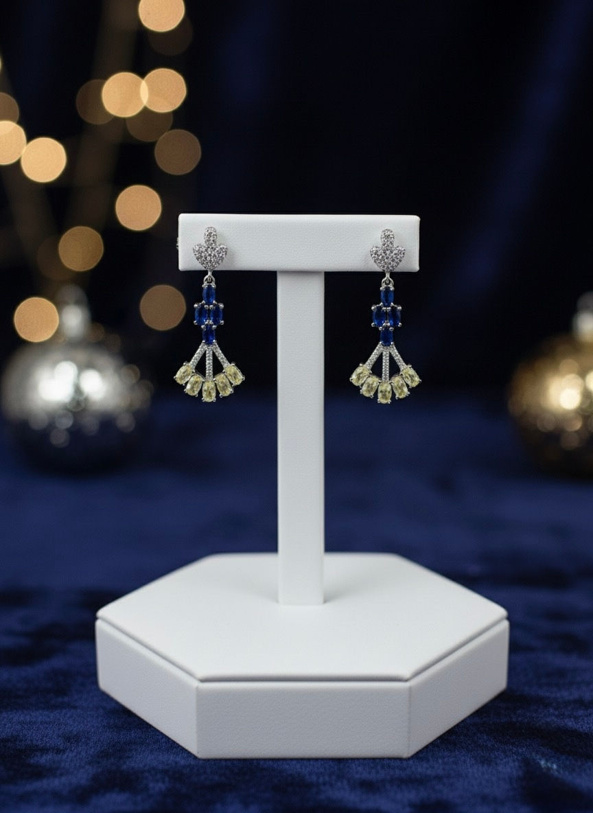 Elegant Zirconia Gold Colour Earring, sapphire and diamond earrings on display, lavish jewelry.