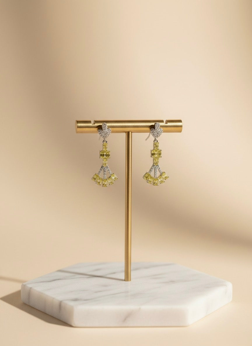 Pair of yellow and silver earrings on gold stand, Lavish Jewellery.