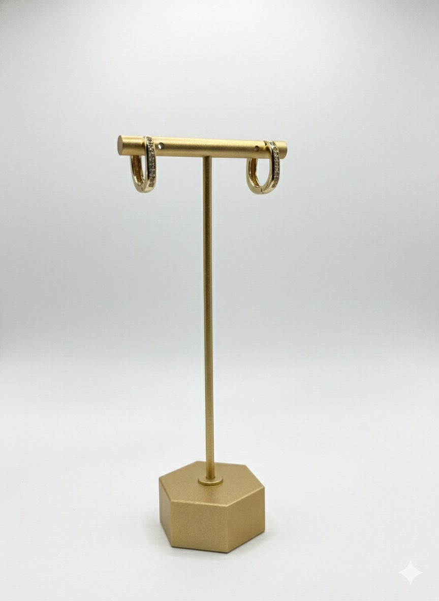 Gold hoop earrings on display stand, Lavish Jewellery on white background