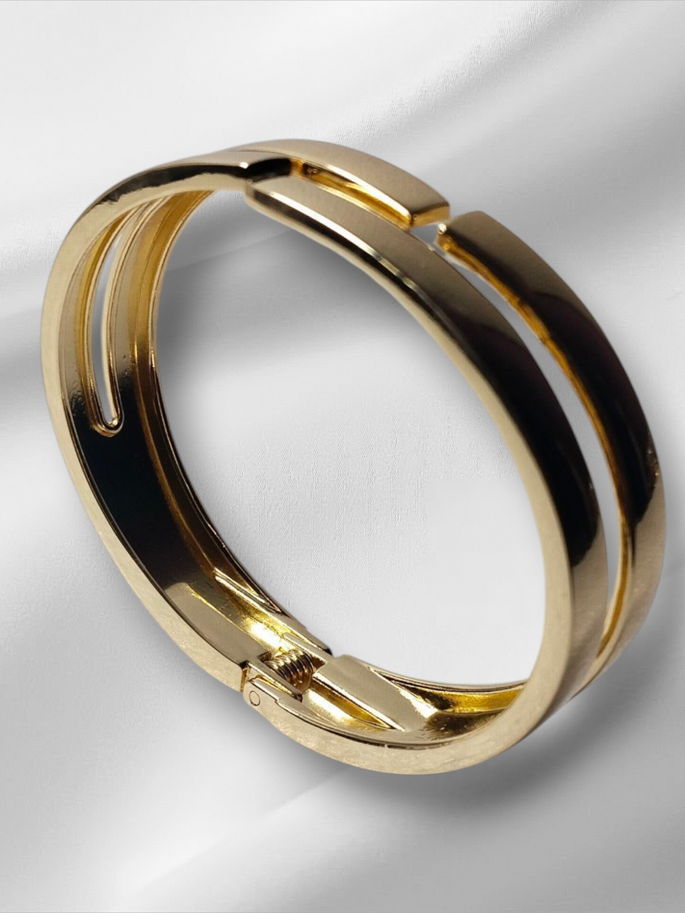 Golden bangle, Thin size openable Kada, simple layered design on white cloth background