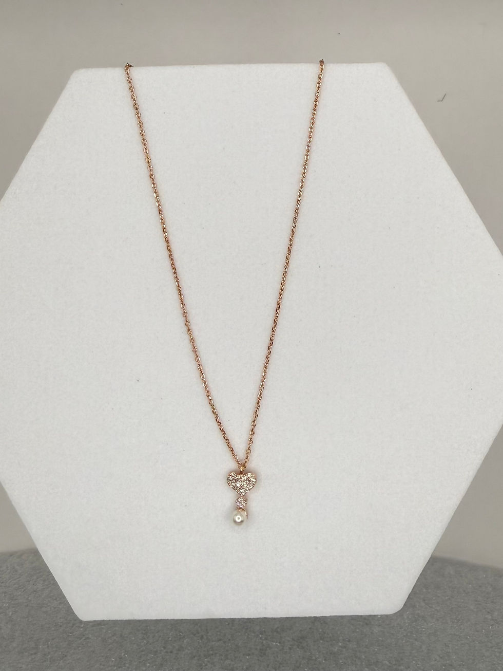 Rose gold key pendant necklace on display, exquisite Lavish Jewellery.