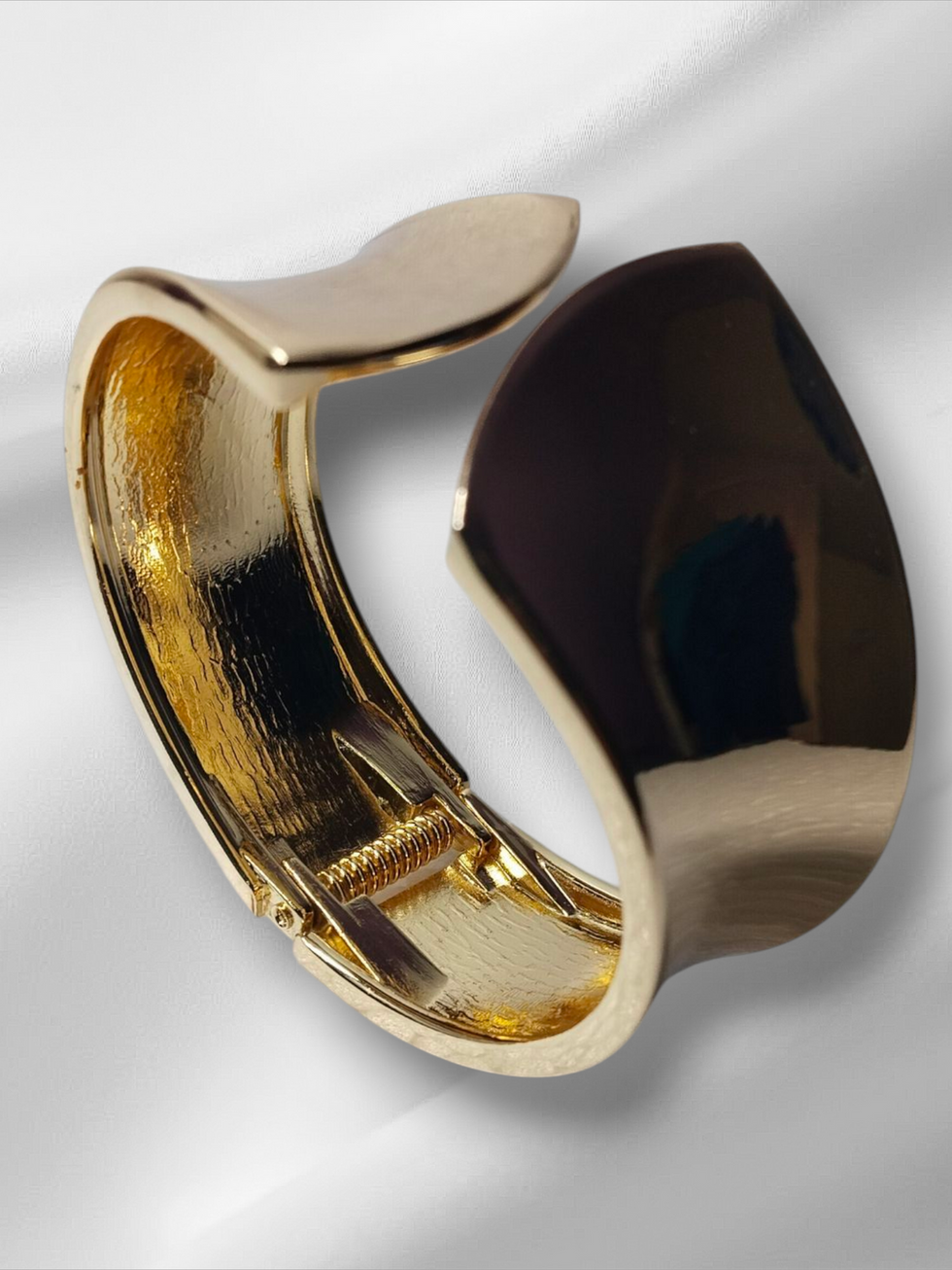 Golden openable Kada reflecting light, elegant design, and smooth curves, Lavish Jewellery.