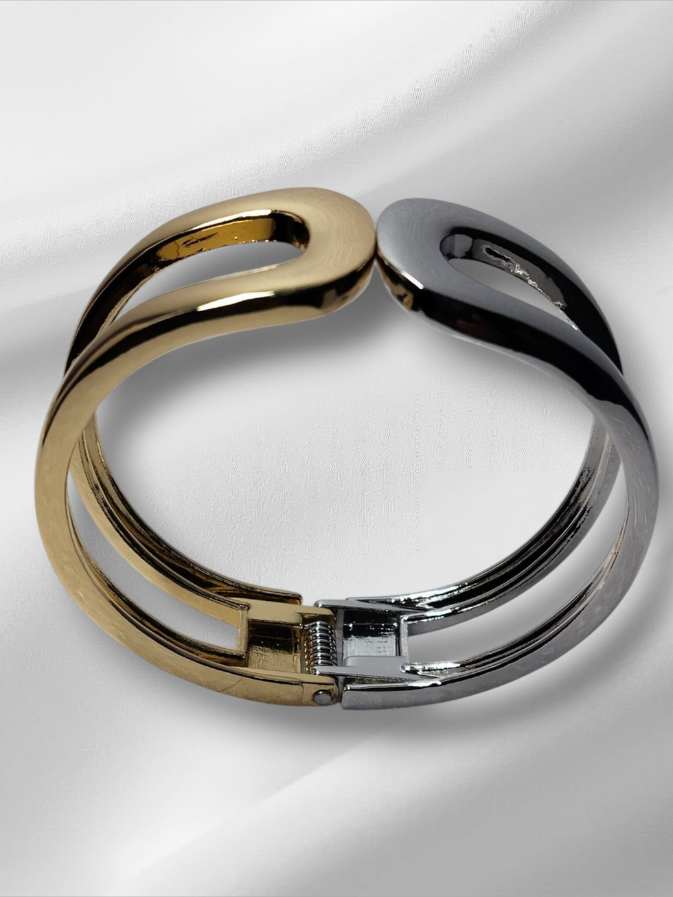 Gold and silver open Kada on white background, lavish jewellery design.