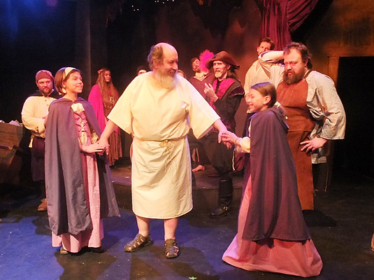 DRIVEN = priest with girls brighter.JPG