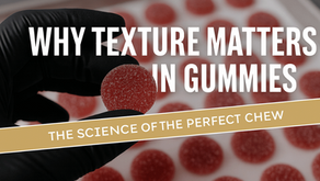 Gloved hands arranging sugar-coated round cannabis gummies on a tray during the TexaKana manufacturing process.