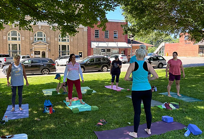 Individuals participating in yoga class