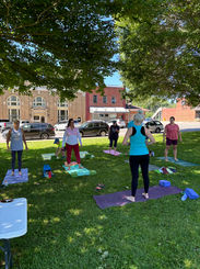 Yoga class taking place on the town square