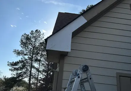"Home exterior siding repair and maintenance service performed by a local handyman in Between, Georgia."