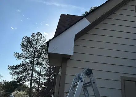 "Home exterior siding repair and maintenance service performed by a local handyman in Lawrenceville, Georgia."