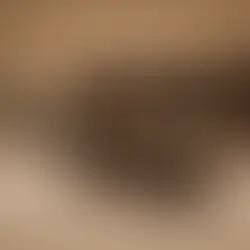 A spacious  finished basement with beige carpet a large dark wood entertainment center with built-in shelving  and cabinets , a center island with  a granite countertop  and sinks , and a staircase leading to the upper level. recessed lighting illuminates the space , and two framed pictures hang on the left wall