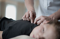 a woman getting a massage from a man in a white shirt_edited.jpg