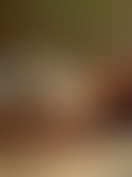 A serene person lying comfortably on a yoga mat with a peaceful expression, with subtle visualization showing energy moving through different parts of their body in a gentle flow from feet to head, set in a calm, natural setting with soft lighting.