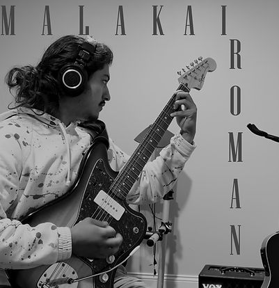 Picture of Malakai Roman holding a guitar with his name in text around him.