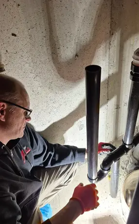 Maple ON Ultrefina Softener KW2 installation site, technician install p-trap for proper drainage