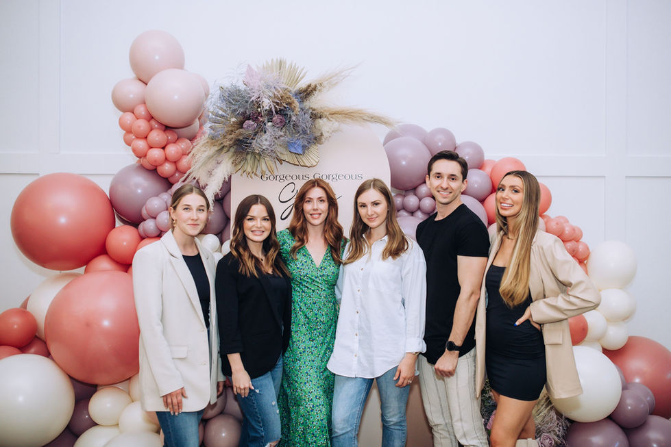 Honey at Hutton House - team photo near balloon installation and backdrop