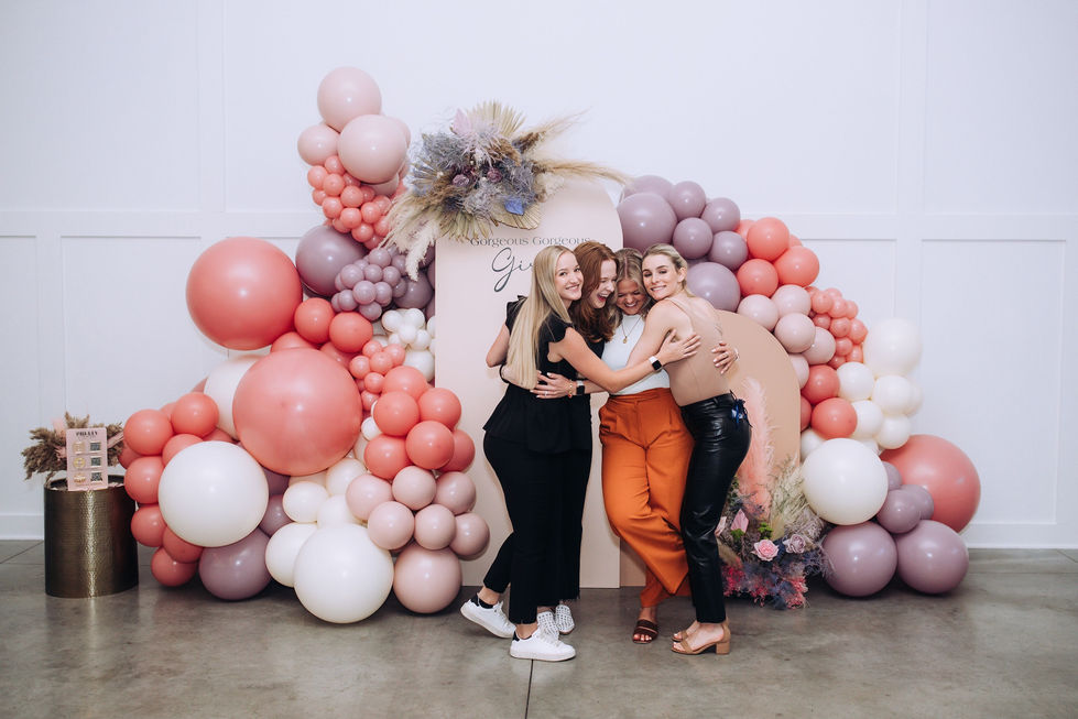 Honey at Hutton House - group photo near full backdrop and balloon installation