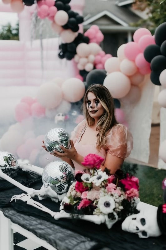 PCE Halloween - cassie with the skeleton floral installation and the disco ball