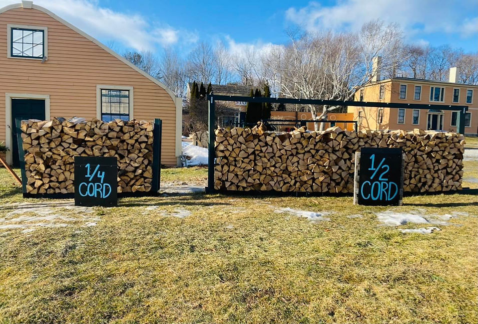 Two firewood stacks showing a quarter and half cord