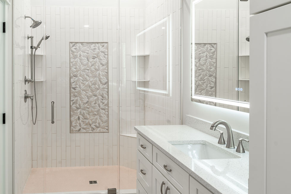 The bathroom shower features a custom accent wall design.
