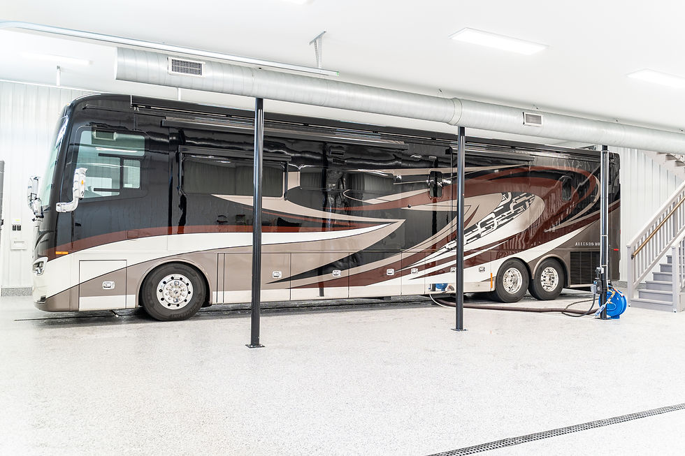 There are full hookups (water, power and sewer) on both sides of the garage so you can pull or back in. Keystone floor drains in the middle make for easy washing of RVs and other vehicles.