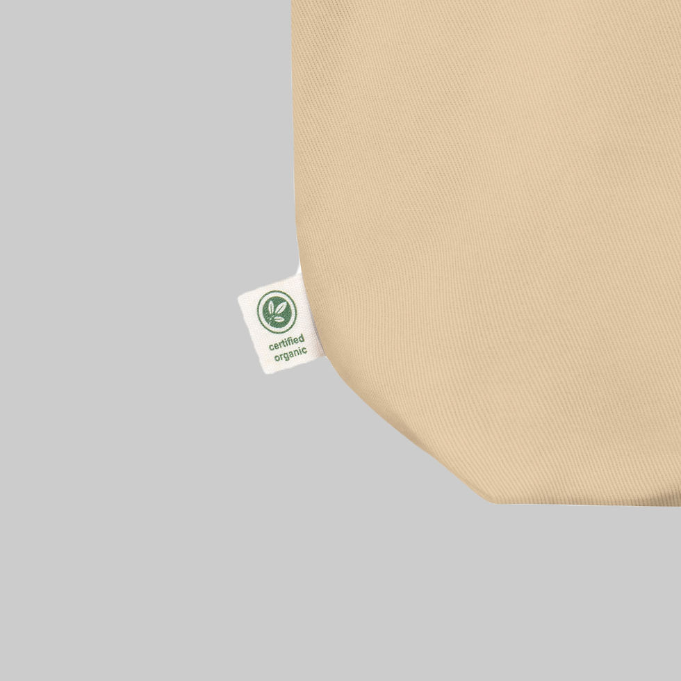Thumbnail: Close-up of The W.B. Tote showing organic cotton fabric texture and certification tag.