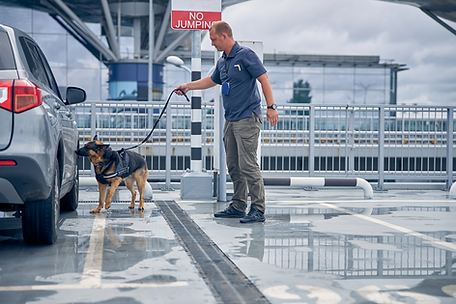 officer-with-dog-checking-WEB.png