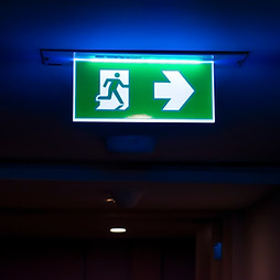 Signs for fire escape inside the building. That is turning on the lights at night..jpg