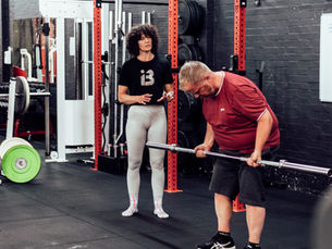 Coach with a member giving tips