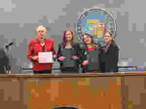 President Toni Preckwinkle and Distrct 12 Commissioner Bridget Degnen recognize Natalie Rohman and Callie Boboc for Love Where You Count in an official resolution