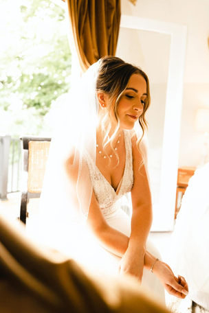 "Bride with soft glam bridal makeup and updo at outdoor summer wedding in Washington."