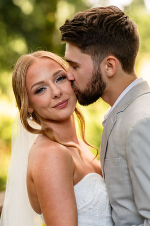 "Bride with soft glam bridal makeup and updo at outdoor summer wedding in Washington."