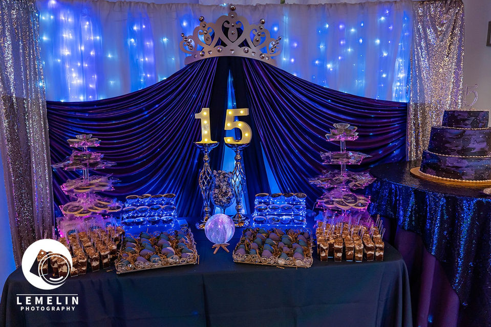 a dessert display with blue and purple decorations.
